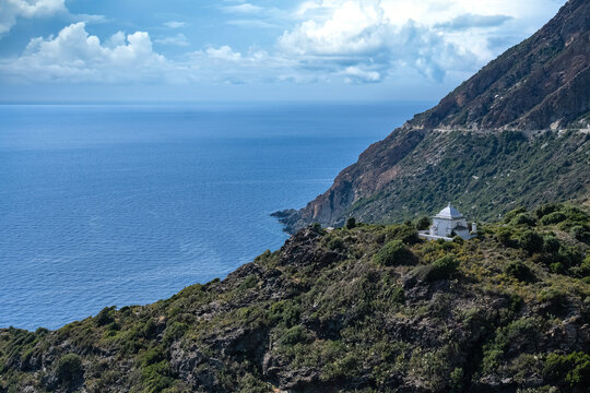 Corsica, seascape of the cap Corse, a chapel in the mountain, turquoise sea on sunny day
