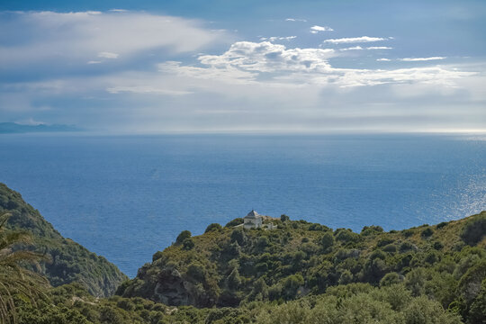 Corsica, seascape of the cap Corse, a chapel in the mountain, turquoise sea on sunny day
