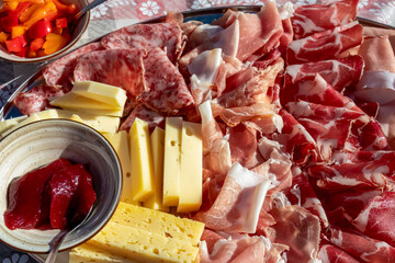 Typical meat plate served in traditional mountain cottage in Carnic Alps, Friuli Venezia Giulia,...