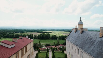 backward drone shot revealing the chateau de Boutheon in Andrezieux Boutheon, Loire Forez, Loire departement, France