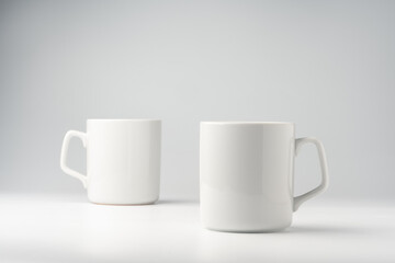 Blank white mugs mock up on white background