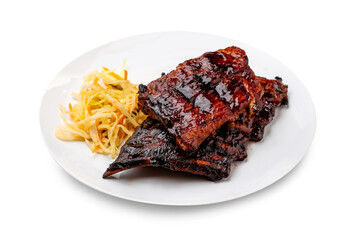 Pork ribs in a white plate. Isolated.