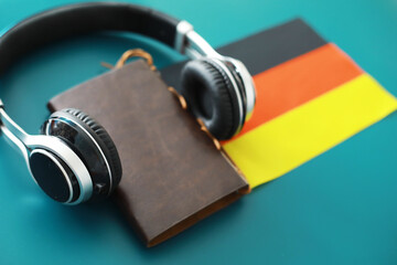 Headphones and flag. The study of foreign subjects. Audiobooks in a foreign language. Language...