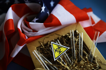 American flag and biohazard sign. The concept of American biolabs and research centers.