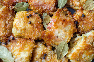 Fried fish fillet. Pieces of fried sea bass fillet. Close-up. Top view.