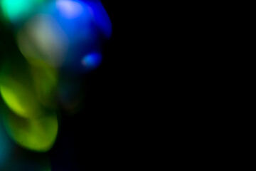 Multicolored highlights on a black background. for overlay to create a festive, vibrant effect