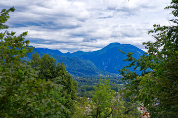 Aerial view of Slovenian village in the background seen from Bled Castle on a blue cloudy summer day. Photo taken September 14th, 2023, Bled, Slovenia.