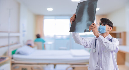 Doctor checking chest x-ray film in hospital