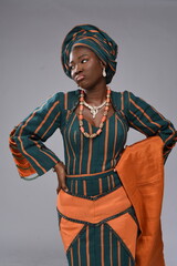 Young black Yoruba lady upset sad angry Nigerian African looking gorgeous woman lady wearing native attire 