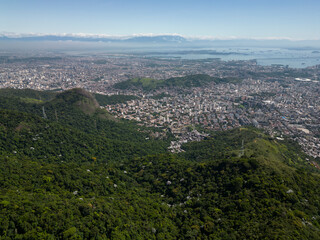 Fototapeta premium Beautiful aerial view to green rainforest mountains and city