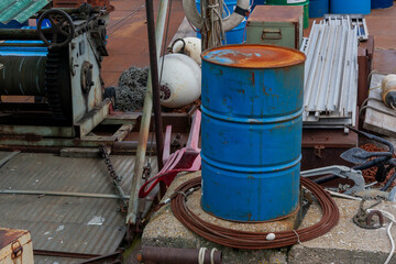Fototapeta na wymiar Used rusty blue drum on a boat deck, Lake Geneva, Geneva ,Switzerland