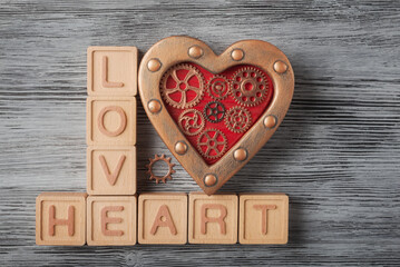 Love Heart with Steampunk Gears on texture wooden background