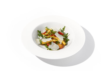 Artichoke and tomato salad with shaved Parmesan cheese
