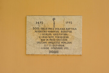 A plaque commemorating 500 years since the arrival of the Modrus-Krbavska chapter and Bishop Kristofor in the city. In the Stari Grad historic centre Novi Vinodolski, Primorje-Gorski Kotar, Croatia