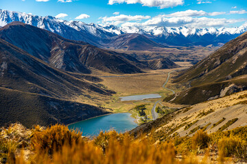 Fototapeta premium panorama of mountains in torlesse tussocklands national park, canterbury, new zealand south island; trail to trig m with panorama of alps and lake lyndon