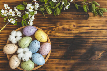 Spring Easter composition. Postcard on the table with flowers and Easter eggs. Preparation for the celebration of Easter.