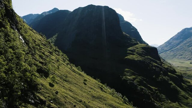 Drone shot of Glencoe Valley's steep mountainside in Scotland.
