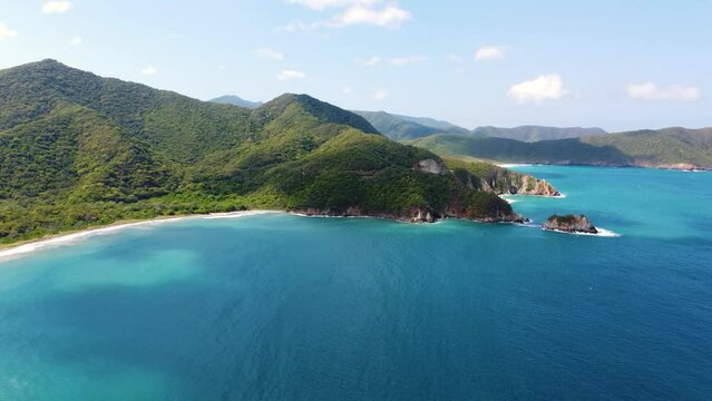 Shadow of clouds moving over Tayrona National Park. Aerial view