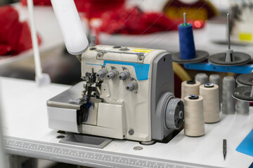 the overlock. automatic sewing machine on the textile production factory