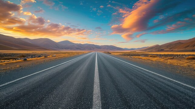 Straight asphalt road and mountain with sky clouds background at sunset