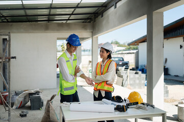 Fototapeta premium team engineer, foreman, architect meeting for colleagues discussing and checks construction blueprints at onsite