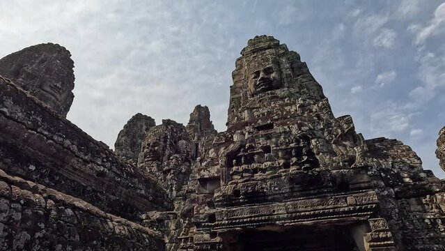 The Bayon Temple at Angkor, showcasing its iconic stone faces and intricate carvings. Check the gallery for similar footages.