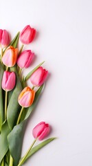 
Beautiful tulips for Mother's Day on a light background, top view