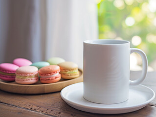 Obraz na płótnie Canvas White mug cup on a wooden plate and colorful macaroons 