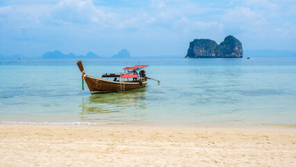 Fototapeta na wymiar Longtail boats on the beach of Koh Ngai island tropical Island in the Andaman Sea Trang in Thailand