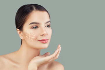  Lovely woman. Face lift anti-aging lines on young female face. Graphic lines showing facial lifting effect on skin. Plastic surgery, cosmetology and massage concept