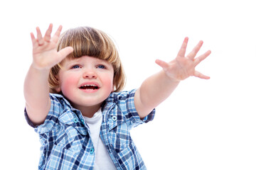 A little 2-year-old boy screams and raises his hands up. Cute child in jeans and a plaid shirt. Curiosity and emotionality. Isolated on a white background. Close-up.