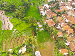 Aerial View of Nagreg City - Indonesia from the Sky. There are rice fields, valleys and hills,...