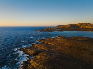 Drone view of Isola Piana by La Pelosa Beach, Sardinia. Well-preserved ruins of Torre di Punta...
