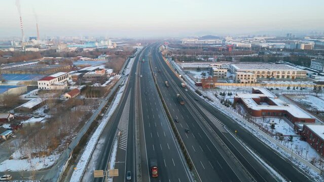 Aerial view of Qingdao-Yinchuan-Expressway near Zibo City during sunset hour in winter time. Shandong Province, China