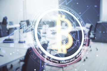 Virtual Bitcoin hologram on a modern furnished office background. Multiexposure