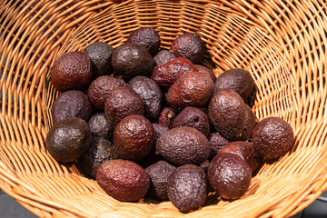 Basket with avocado in a supermarket, close up.