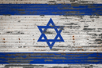 Close-up of old metal wall with national flag of Israel. Concept of  Israel  export-import, storage...