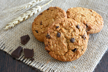 american cookies with chocolate chips on burlap texture close up