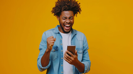 an exuberant young person with curly hair, holding a smartphone and seemingly shouting or cheering with a bright yellow background