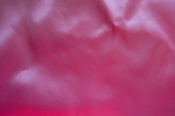 Top view of cold pink satin polyester fabric