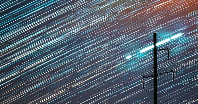 4k Hyperlapse Night Starry Sky. Trails Of Stars Rotate Above Power Line. Spin Trails Of Stars On Night Sky Background. Unusual Amazing Effects In Sky. Large Exposure. Time Lapse, Timelapse, Time-lapse