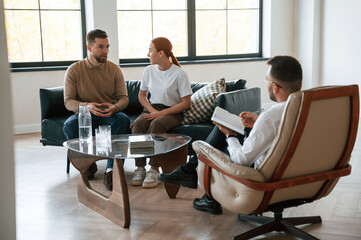 Sitting and talking. Couple at a psychologist's appointment