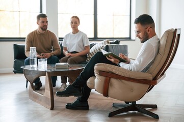 Sitting and talking. Couple at a psychologist's appointment