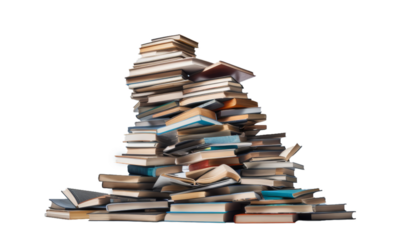 Towering stack of various books against a dark background