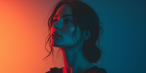 Striking woman in profile with red and blue lighting, highlighting her sharp features and serene expression