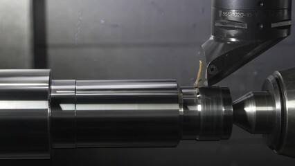 automated CNC lathe machine shaping metal with precision and accuracy