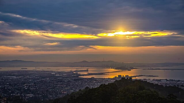 San Francisco Bay as seen from Oakland California - sunset twilight to nighttime time lapse colorful cloudscape