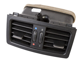 A close-up view of a part of the interior of a modern car with a view of the ventilation deflector of the heater for heating and cooling the rear passenger compartment. Used auto part catalog junkyard