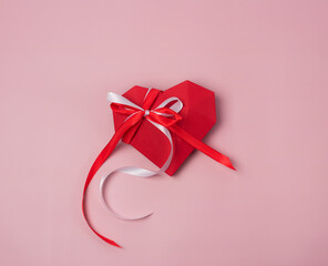 Gift box for Valentine's Day on Pink background St Valentine Day Background or Card Horizontal