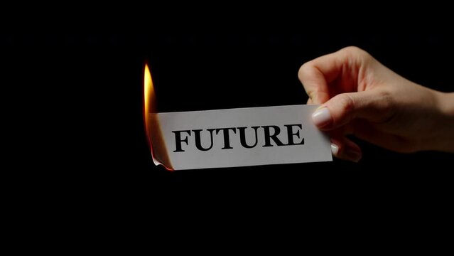 Flaming paper with word Future in female arm in studio